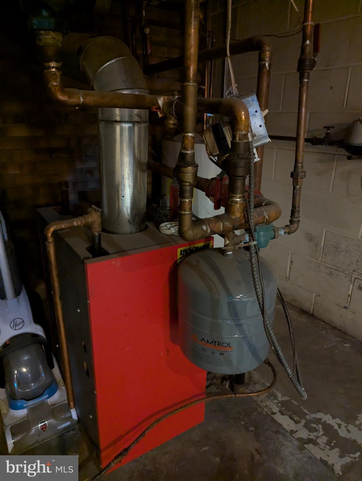 44 Chestnut Street Adamstown, PA 19501 - Photo 7 of 24 a room with water heater and wooden cabinets
