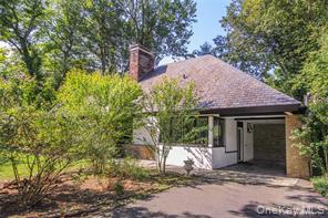 112 Kingsbury Road New Rochelle, NY 10804 - Photo 1 of 1 a front view of a house with a yard and garage