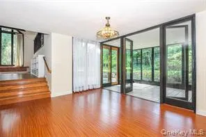 a view of an entryway with wooden floor
