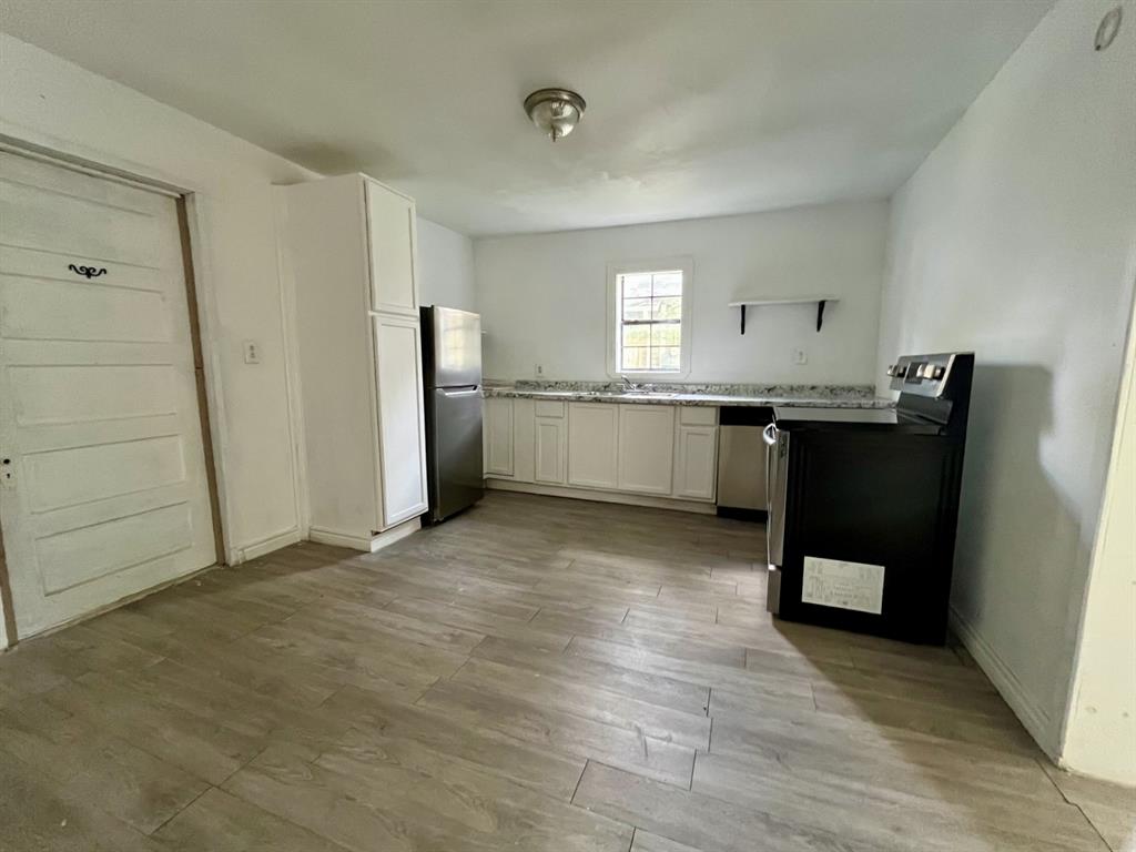1037 Cedar Street Paris, TX 75460 - Photo 5 of 13 a view of a kitchen with a sink