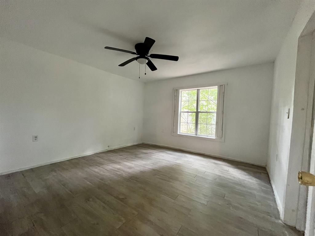 1037 Cedar Street Paris, TX 75460 - Photo 8 of 13 a view of empty room with ceiling fan