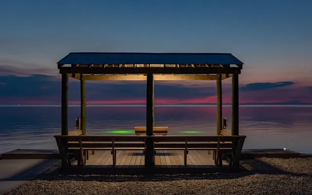 a view of a lake with a yard