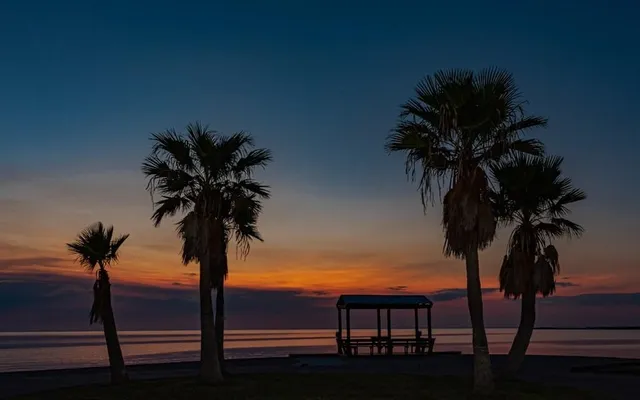 a view of swimming pool with outdoor seating and city view