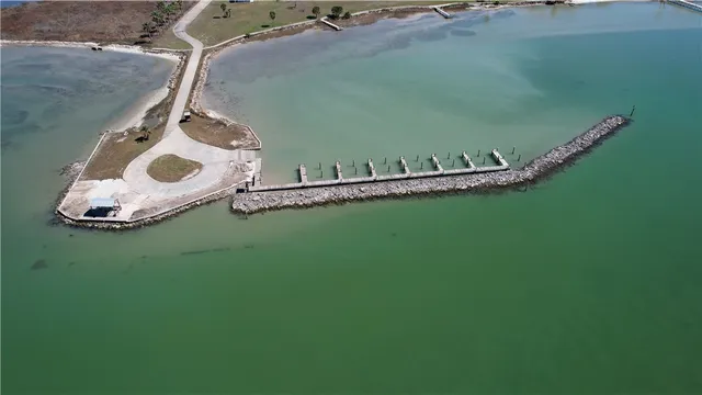 an aerial view of a house with a lake view