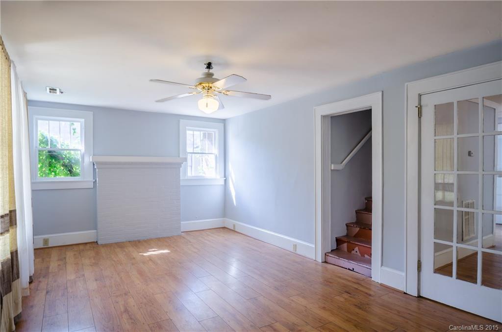 2904 Tuckaseegee Road Charlotte, NC 28208 - Photo 2 of 21 an empty room with wooden floor and window