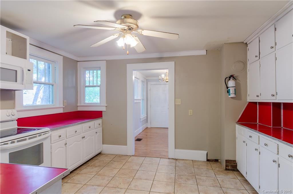 2904 Tuckaseegee Road Charlotte, NC 28208 - Photo 11 of 21 a view of a kitchen with utility room and windows