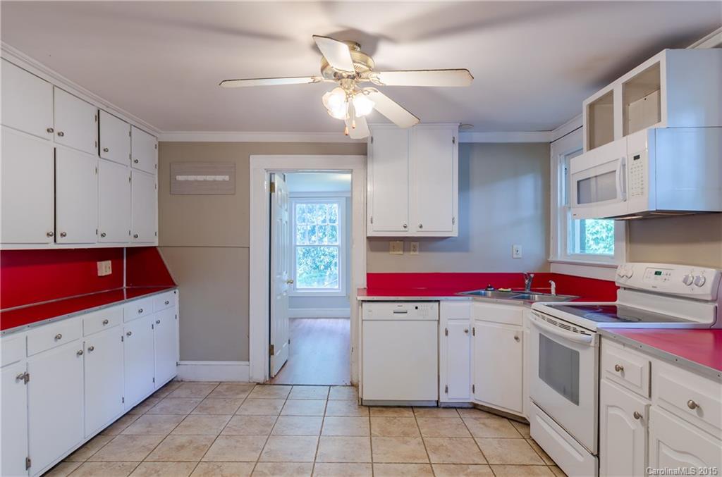 2904 Tuckaseegee Road Charlotte, NC 28208 - Photo 12 of 21 a kitchen with a sink cabinets and appliances