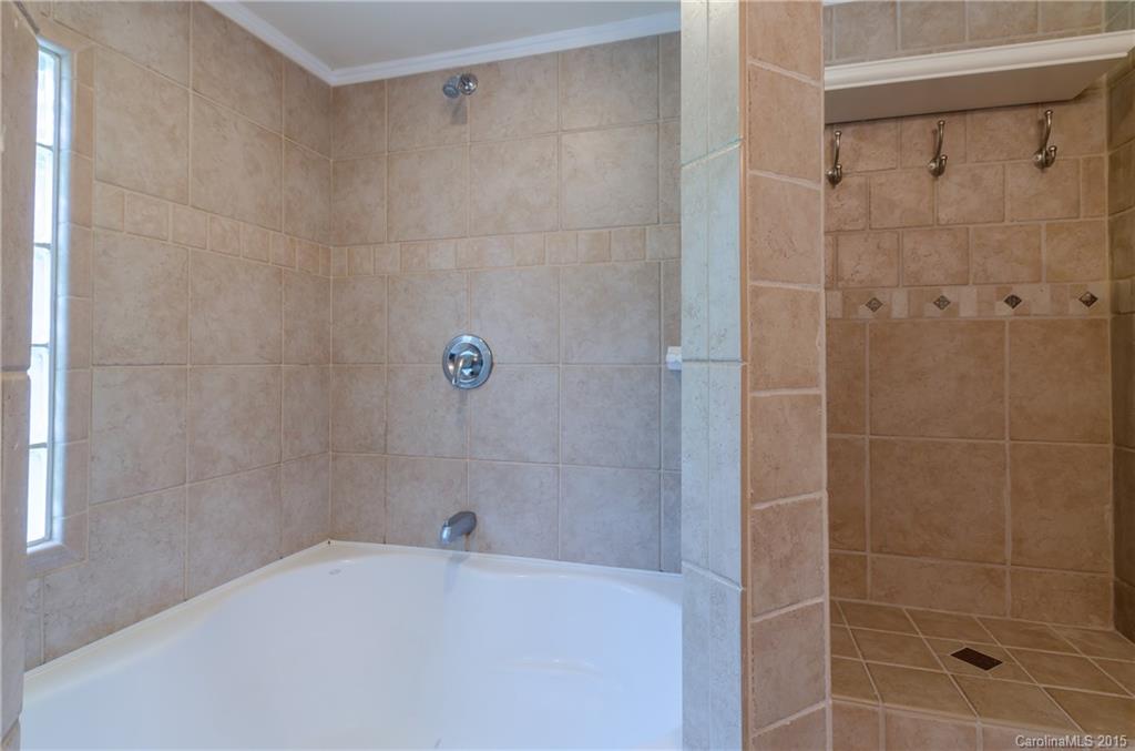 2904 Tuckaseegee Road Charlotte, NC 28208 - Photo 16 of 21 a bathroom with a bathtub and a shower