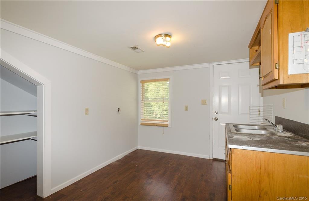2904 Tuckaseegee Road Charlotte, NC 28208 - Photo 18 of 21 a view of a kitchen cabinets and wooden floor