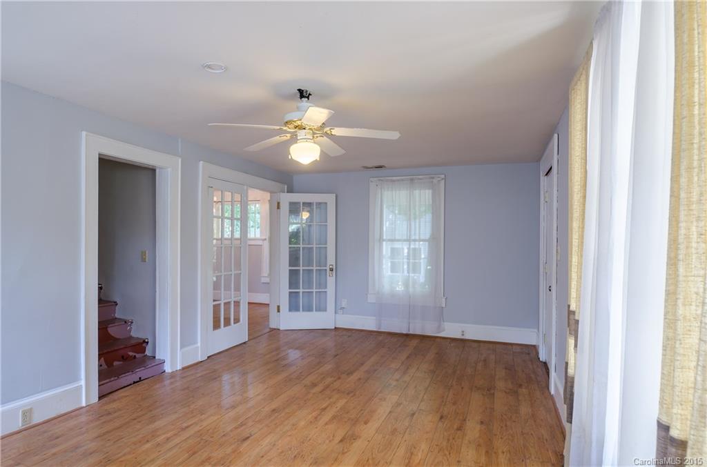 2904 Tuckaseegee Road Charlotte, NC 28208 - Photo 3 of 21 an empty room with wooden floor and window