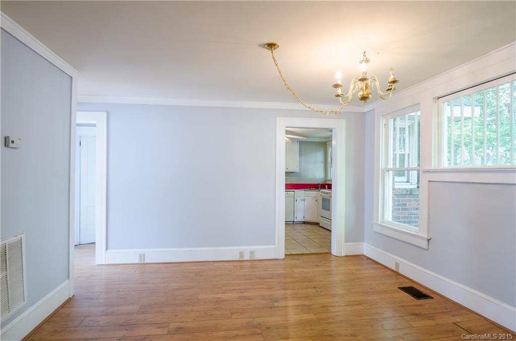 2904 Tuckaseegee Road Charlotte, NC 28208 - Photo 4 of 21 wooden floor in an empty room with a window