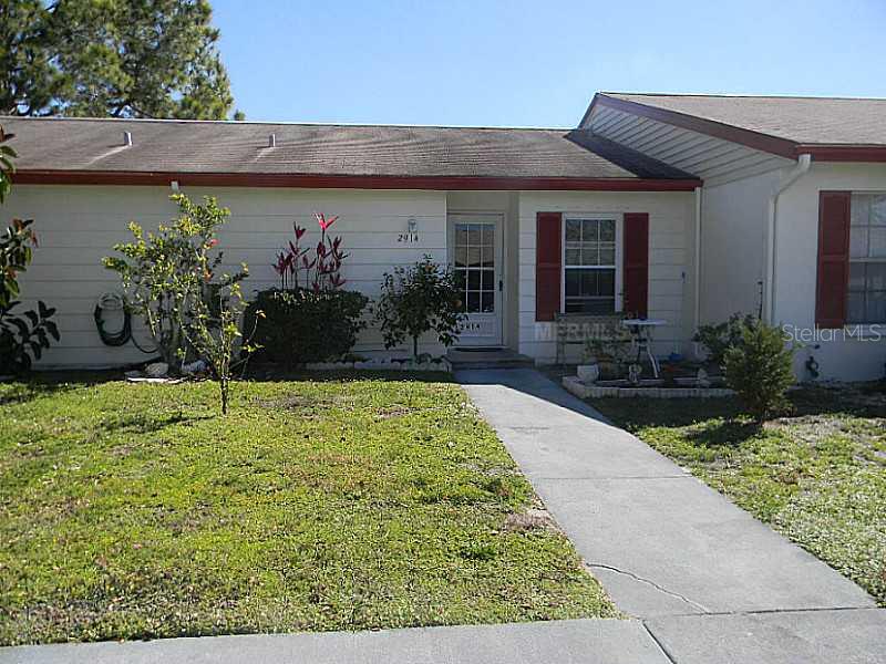 2914 Forrestal Court New Port Richey, FL 34655 - Photo 1 of 1 front view of house with potted plants