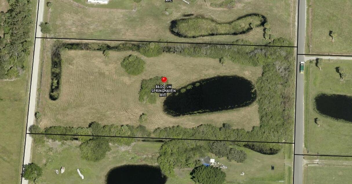 8600 Southwest Springhaven Avenue Indiantown, FL 34956 - Photo 1 of 14 a bathroom with a bathtub and shower