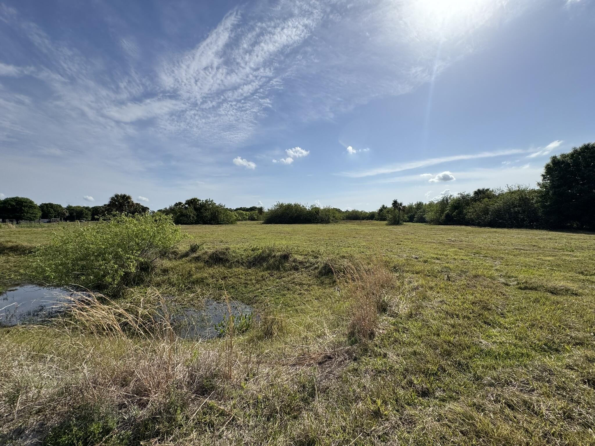 8600 Southwest Springhaven Avenue Indiantown, FL 34956 - Photo 12 of 14 a view of a lake with houses in the back