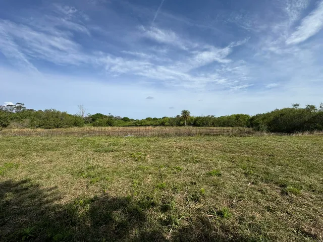 a view of a lake with houses in the back