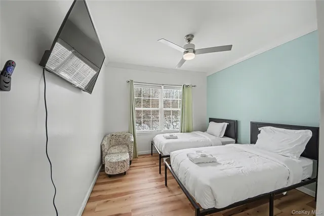 a bed room with a bed and a window