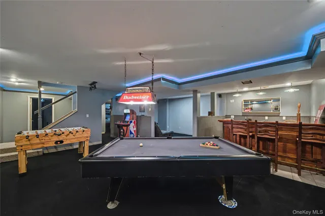 a view of a room with furniture and window