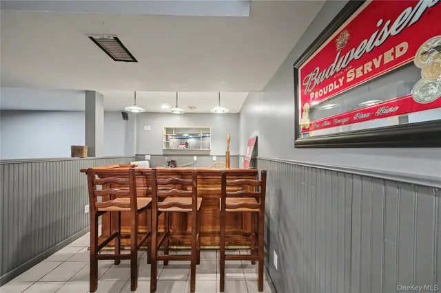 a kitchen with stainless steel appliances kitchen island granite countertop a table and chairs