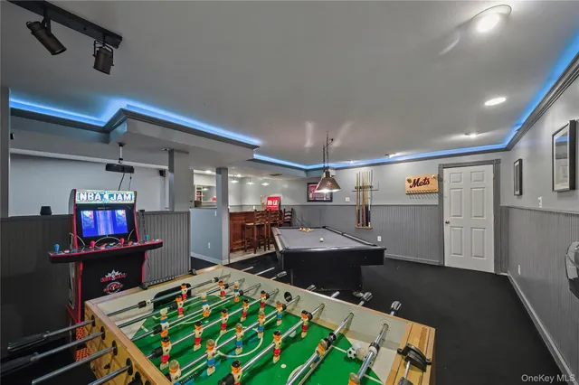 a room with kitchen equipment and a wooden floor