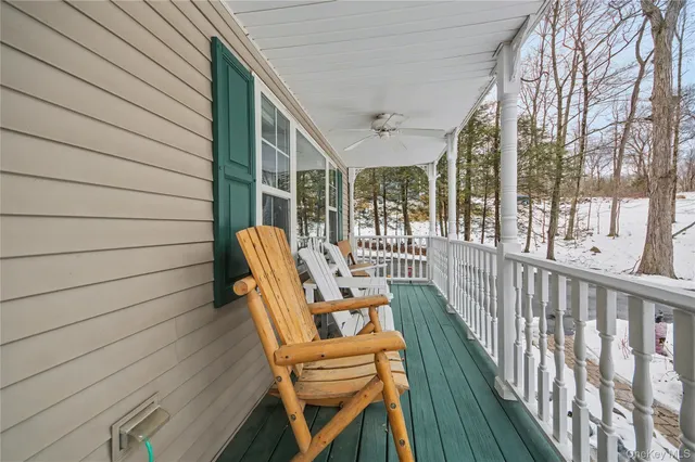 a view of a chair and tables in the balcony