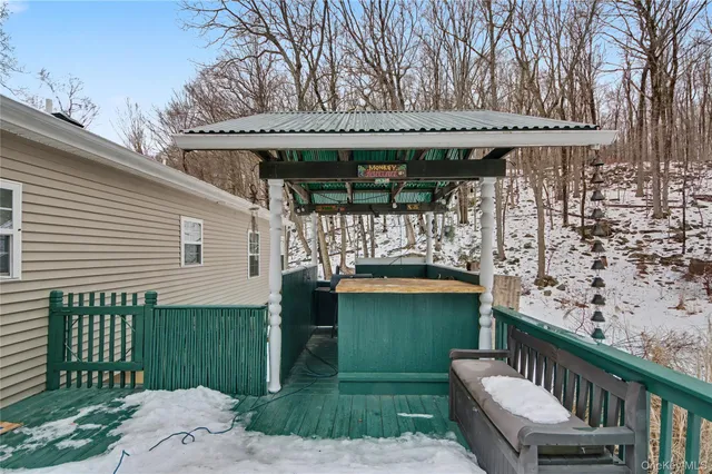 a view of a patio with a table and chairs