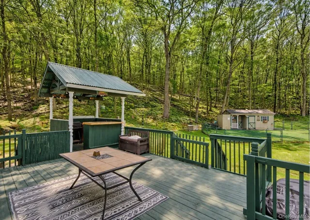 a view of a deck with furniture