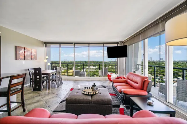 a living room with furniture and a large window