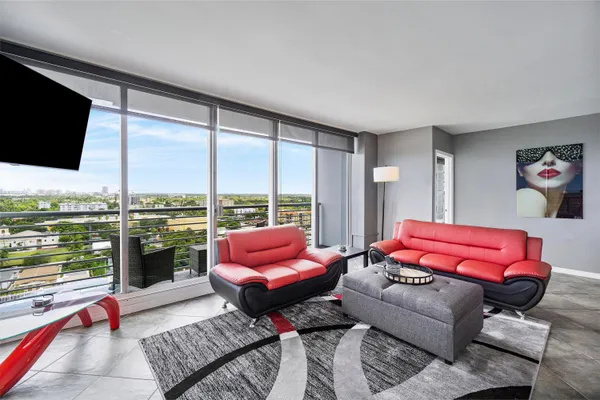 a outdoor living space with furniture and a flat screen tv