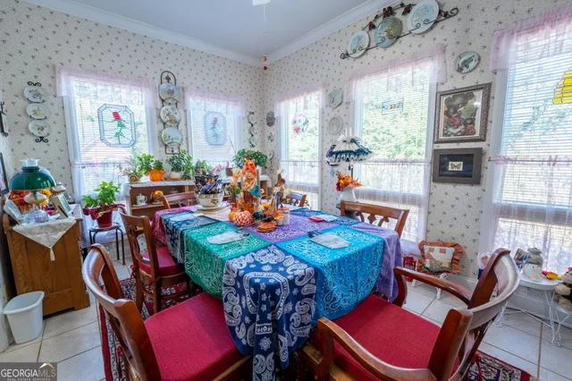a view of a dining room with furniture and a chandelier