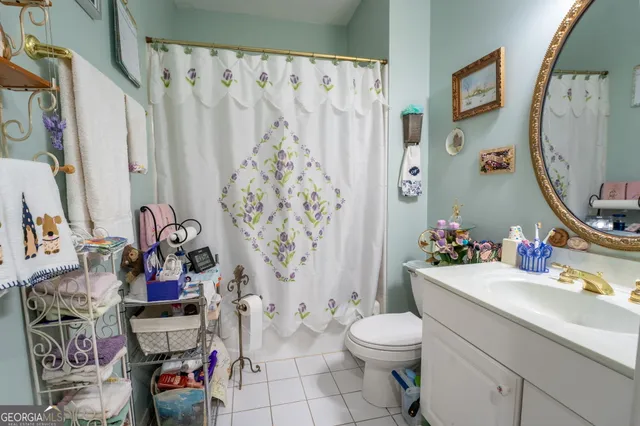 a bedroom with furniture and a chandelier