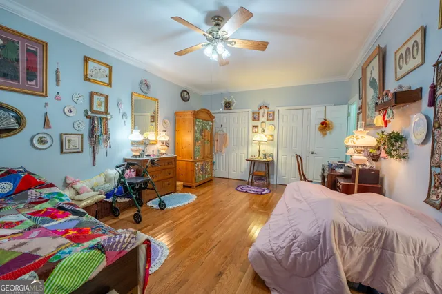 a living room with furniture a clock and a window