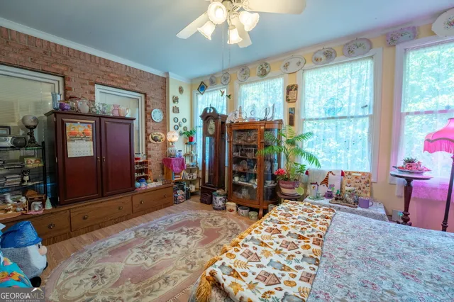 a bedroom with bed and a bookshelf