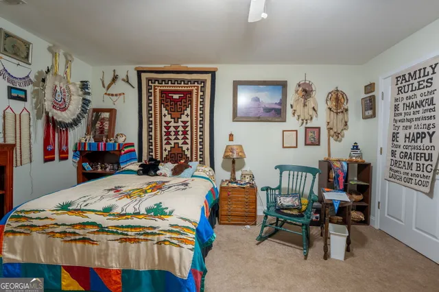 a view of a patio with a table and chairs under an umbrella