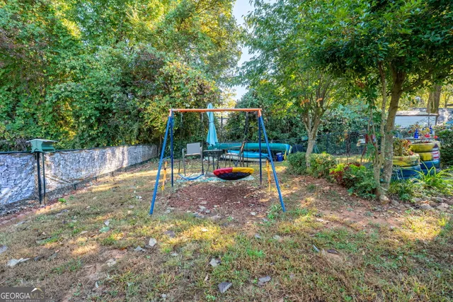 a view of a backyard with sitting area