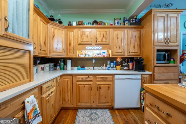 a kitchen with stainless steel appliances granite countertop a stove and cabinets