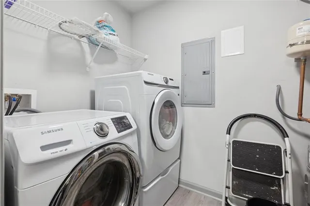 a view of storage and utility room with washer and dryer
