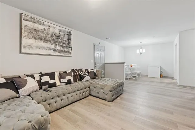 a large bedroom with a bed and a couch