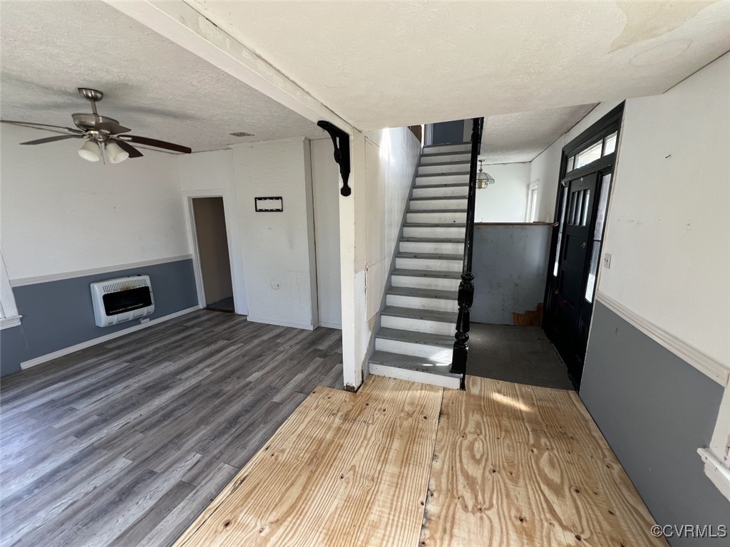 2307 New Point Comfort Highway Mathews, VA 23109 - Photo 14 of 20 a view of a livingroom with wooden floor and stairs