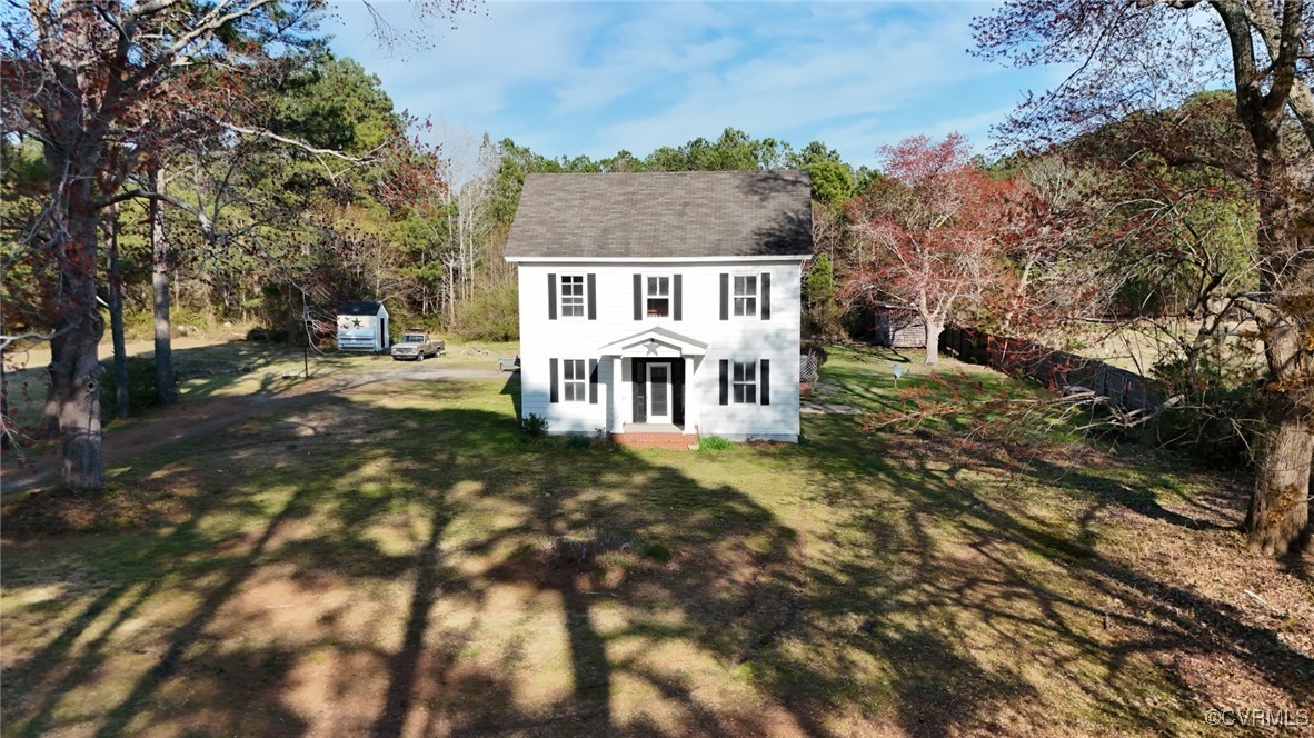 2307 New Point Comfort Highway Mathews, VA 23109 - Photo 3 of 20 a view of a house with a yard