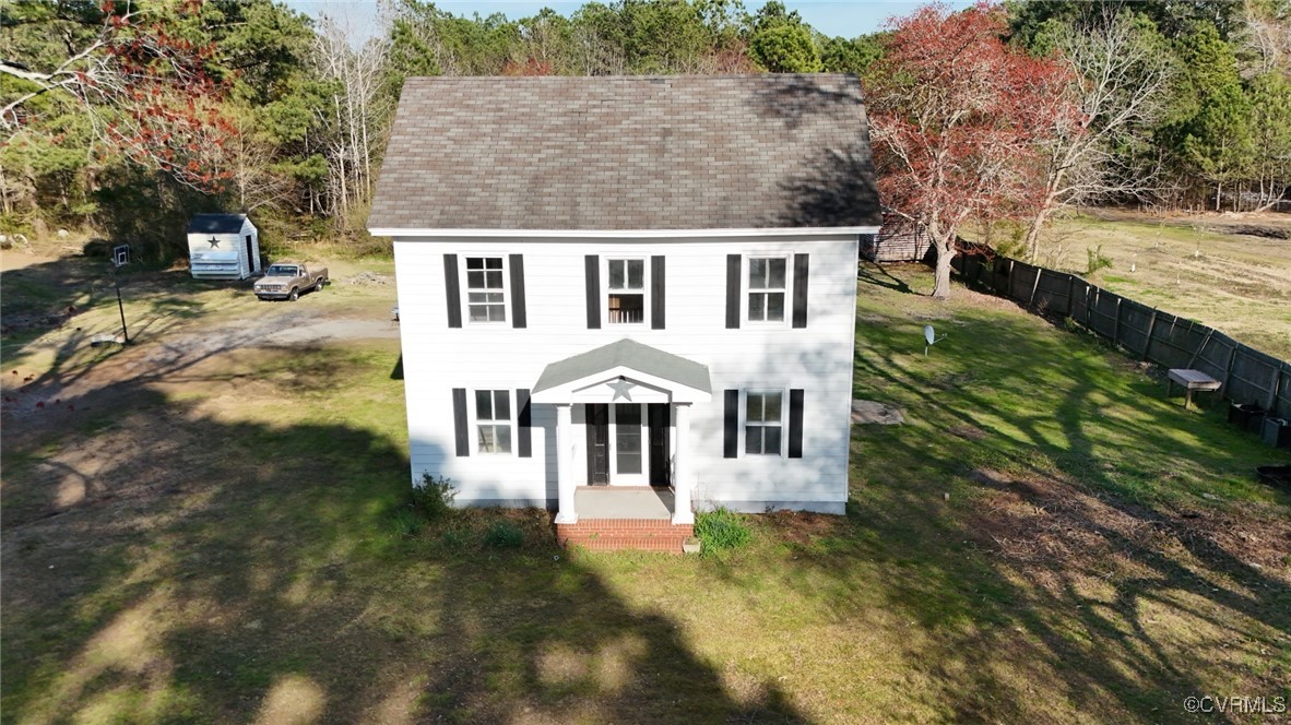 2307 New Point Comfort Highway Mathews, VA 23109 - Photo 4 of 20 a view of a house with a yard