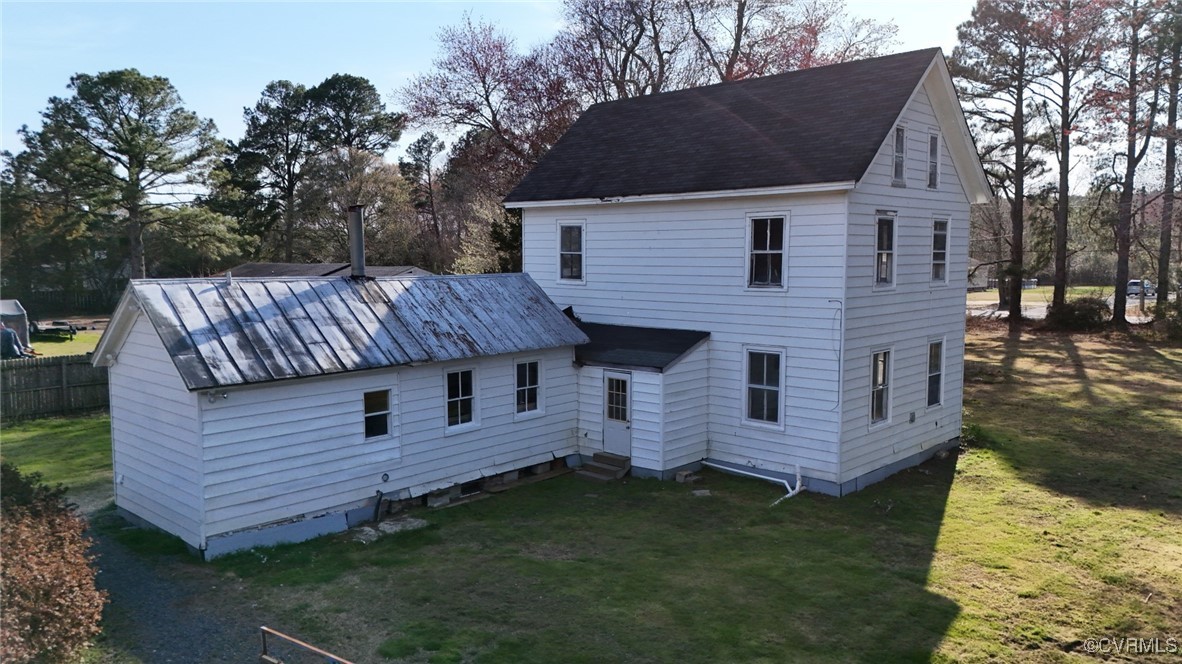 2307 New Point Comfort Highway Mathews, VA 23109 - Photo 5 of 20 a view of a house with a back yard