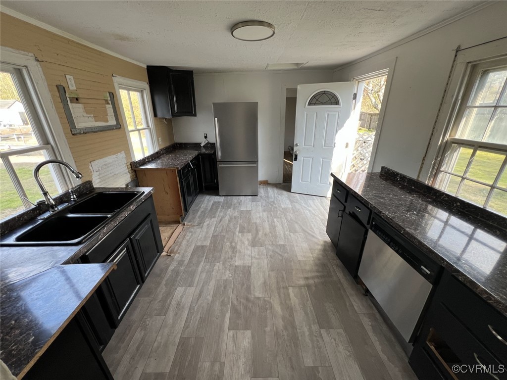 2307 New Point Comfort Highway Mathews, VA 23109 - Photo 9 of 20 a kitchen with stainless steel appliances granite countertop a stove a sink and a microwave