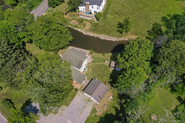 an aerial view of a house with a yard