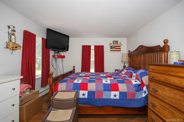 a bedroom with a bed and a tv in it