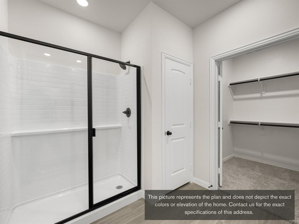 1813 Zelvia Lane Waco, TX 76708 - Photo 2 of 24 a view of a bathroom with a glass door