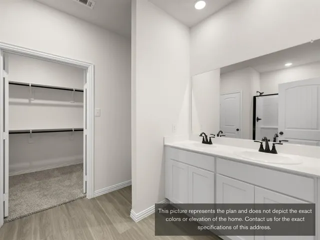 a bathroom with 2 sink and a mirror