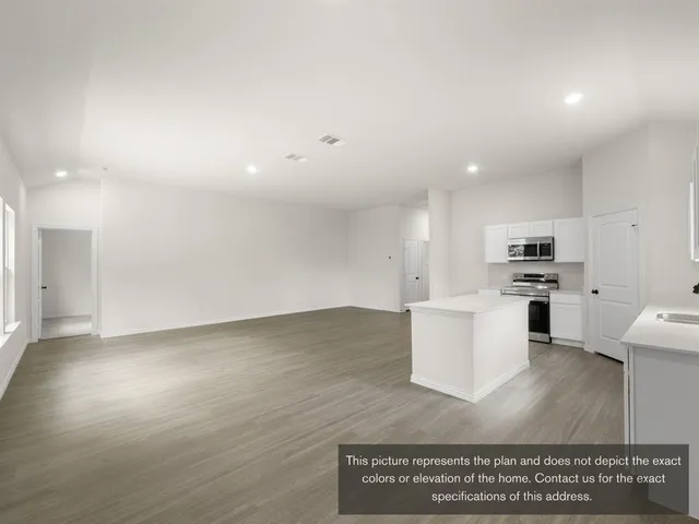 a view of kitchen with wooden floor