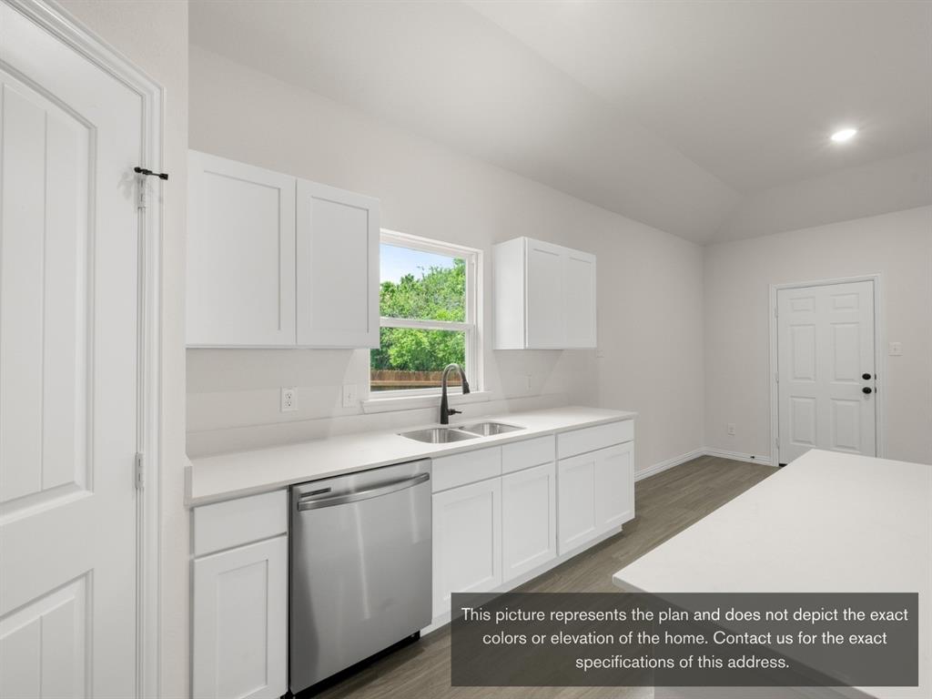 1813 Zelvia Lane Waco, TX 76708 - Photo 9 of 24 a kitchen with a sink and cabinets