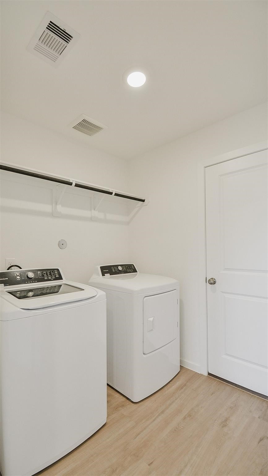 18566 Cepagatti Drive New Caney, TX 77357 - Photo 13 of 35 a utility room with washer and dryer