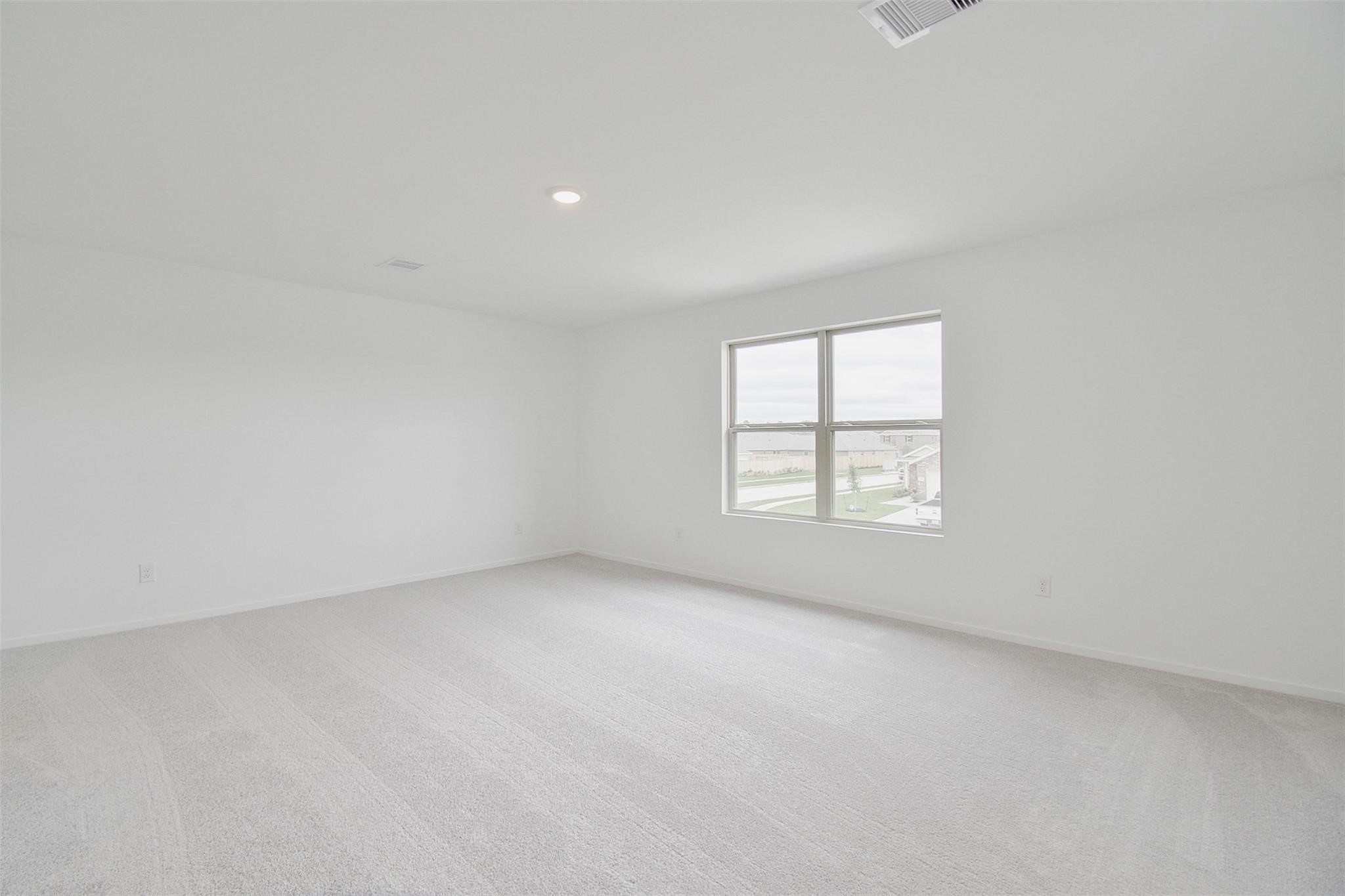 18566 Cepagatti Drive New Caney, TX 77357 - Photo 19 of 35 an empty room with a window